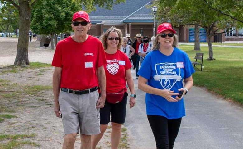 Don and Diana Tallman lead a Parkinson Canada SuperWalk group from Boxing 4 Health