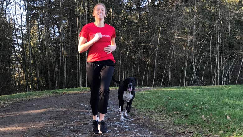 Photo of Danielle Groenendijk running with her dog